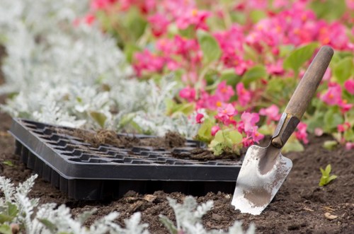 Professional landscaper maintaining a lush garden